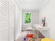 Bright office space featuring paneled walls and a white modern desk, with a colorful rug at 2260 Old Spring Se Rd, Smyrna, GA 30080