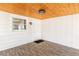 Inviting porch with wood ceiling, white walls, a white door and a floor mat, creating a cozy and stylish outdoor space at 2260 Old Spring Se Rd, Smyrna, GA 30080