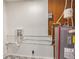 A utility room includes an updated hot water heater and modern plumbing at 2260 Old Spring Se Rd, Smyrna, GA 30080