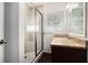 Bathroom boasts a tiled glass shower and vanity with granite countertop at 2308 Scotty Cir, Decatur, GA 30032