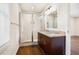 Modern bathroom featuring a glass-enclosed shower and granite countertop vanity at 2308 Scotty Cir, Decatur, GA 30032
