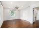 Spacious bedroom with hardwood floors, ceiling fan, closet, and large window with natural light at 2308 Scotty Cir, Decatur, GA 30032