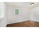 Bedroom with hardwood floors, white walls, and a window with natural light at 2308 Scotty Cir, Decatur, GA 30032