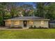 Charming brick ranch home with a manicured lawn and lush greenery creating inviting curb appeal at 2308 Scotty Cir, Decatur, GA 30032