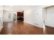 Open concept living room with hardwood floors and kitchen with dark cabinets and stainless steel appliances at 2308 Scotty Cir, Decatur, GA 30032