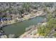 An aerial view of houses lining a scenic lake, showcasing community near the beautiful waterfront property at 26 Kensington Rd, Avondale Estates, GA 30002