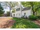 Rear exterior view with lots of natural light and a beautiful backyard with mature trees at 26 Kensington Rd, Avondale Estates, GA 30002