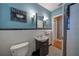 Well-lit bathroom featuring black and white patterned flooring, a white sink, and decor at 26 Kensington Rd, Avondale Estates, GA 30002