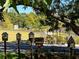 Five decorative birdhouses line a path in the park, adding a touch of charm to the outdoor setting at 26 Kensington Rd, Avondale Estates, GA 30002