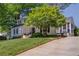 Beautiful home with a lush green lawn, mature trees, and a welcoming driveway at 26 Kensington Rd, Avondale Estates, GA 30002