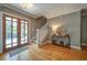 Elegant home entrance with hardwood floors, decorative lighting, and a staircase at 26 Kensington Rd, Avondale Estates, GA 30002