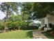 Well maintained lawn, landscaping, and front walkway to the columned porch of this lovely home at 26 Kensington Rd, Avondale Estates, GA 30002
