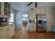 Bright kitchen features stainless steel refrigerator, custom cabinets and an eat-in area at 26 Kensington Rd, Avondale Estates, GA 30002