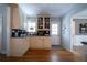Charming kitchen featuring bright lighting, custom cabinets, and hardwood floors at 26 Kensington Rd, Avondale Estates, GA 30002