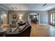 Open-concept living room boasts hardwood floors, arched doorways, and neutral color palette at 26 Kensington Rd, Avondale Estates, GA 30002