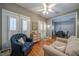 Cozy living room with hardwood floors, white shutters, and comfortable seating area at 26 Kensington Rd, Avondale Estates, GA 30002