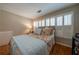 Serene main bedroom with plantation shutters, hardwood floors, and ample natural light at 26 Kensington Rd, Avondale Estates, GA 30002