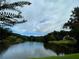 A captivating view of the lake surrounded by lush greenery and a tranquil atmosphere at 26 Kensington Rd, Avondale Estates, GA 30002