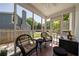 Relaxing screened porch with brick flooring and outdoor seating offering neighborhood views at 26 Kensington Rd, Avondale Estates, GA 30002