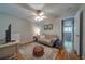 Comfortable sitting room with a ceiling fan, hardwood floors, and cozy seating at 26 Kensington Rd, Avondale Estates, GA 30002