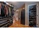 Organized walk-in closet featuring ample storage, shelving, and hardwood floors for storing clothes and shoes at 26 Kensington Rd, Avondale Estates, GA 30002