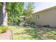 Exterior shot, large trees surrounding the backyard, and a garden at 2825 Harbor Cove Ct, Cumming, GA 30041