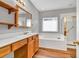 Well-lit bathroom featuring a soaker tub, glass shower, and wood cabinets at 2825 Harbor Cove Ct, Cumming, GA 30041