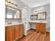 Bathroom featuring double sinks, vanity, modern lights, and wood cabinets at 2825 Harbor Cove Ct, Cumming, GA 30041