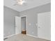 Bedroom featuring a neutral color palette, ceiling fan, and entry door at 2825 Harbor Cove Ct, Cumming, GA 30041