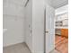 Walk-in closet boasts wire shelving and access to the bathroom for added convenience at 2825 Harbor Cove Ct, Cumming, GA 30041