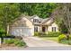 Charming single-Gathering home boasts a two-car garage and manicured landscaping at 2825 Harbor Cove Ct, Cumming, GA 30041