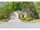 Attractive single-Gathering home with two-car garage and well-maintained yard at 2825 Harbor Cove Ct, Cumming, GA 30041