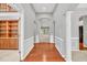 Inviting foyer with hardwood floors, elegant archways, and views into adjoining rooms at 2825 Harbor Cove Ct, Cumming, GA 30041