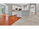 Open concept boasts the kitchen connects to the living room with hardwood floors and carpet at 2825 Harbor Cove Ct, Cumming, GA 30041