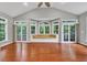 Bright living room featuring hardwood floors, neutral paint, and large windows with a built-in bench at 2825 Harbor Cove Ct, Cumming, GA 30041