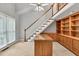 Bright living space with a staircase, built-in shelving, and large windows at 2825 Harbor Cove Ct, Cumming, GA 30041