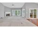 Bright open concept living room with carpeted floors, a fireplace, sliding door access to the deck at 2825 Harbor Cove Ct, Cumming, GA 30041