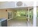 Spacious covered patio with a ceiling fan and ample seating area for outdoor entertaining and relaxation at 2825 Harbor Cove Ct, Cumming, GA 30041