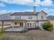 View of the home's backyard and patio with ample space for outdoor activities and entertaining at 4449 Sierra Creek Dr, Hoschton, GA 30548