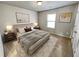 Cozy bedroom with neutral walls, soft carpet, and a comfortable bed at 4449 Sierra Creek Dr, Hoschton, GA 30548