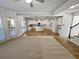 Open-concept living area with a kitchen view, great for entertaining at 4449 Sierra Creek Dr, Hoschton, GA 30548