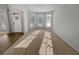 Bright living room featuring a bay window, neutral carpet, and natural light at 4449 Sierra Creek Dr, Hoschton, GA 30548