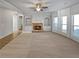 Inviting living room with a fireplace and large windows at 4449 Sierra Creek Dr, Hoschton, GA 30548