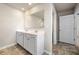 Bathroom featuring a double sink vanity with modern fixtures and ample counter space at 6900 Oak Valley Dr, Douglasville, GA 30134