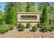 Stone entrance sign for Gateway Village surrounded by lush greenery and landscaping at 6900 Oak Valley Dr, Douglasville, GA 30134