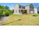 Two-story home with a two-car garage, covered entry and lovely lawn at 6900 Oak Valley Dr, Douglasville, GA 30134