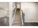 Elegant staircase with dark wood-look flooring leading to the upper level at 6900 Oak Valley Dr, Douglasville, GA 30134