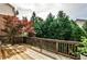 Private wooden deck surrounded by lush greenery and mature trees, perfect for outdoor enjoyment at 11760 Stratham Dr, Alpharetta, GA 30009