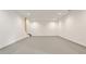 Finished basement features recessed lighting, white walls, and gray flooring at 11760 Stratham Dr, Alpharetta, GA 30009