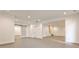 Finished basement featuring recessed lighting, open space, and sliding barn door detail at 11760 Stratham Dr, Alpharetta, GA 30009